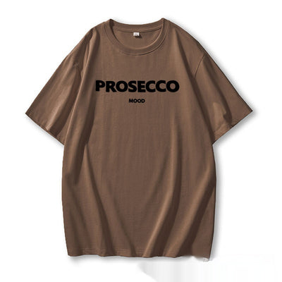 A brown women's t-shirt with "PROSECCO MOOD" text printed on the front.