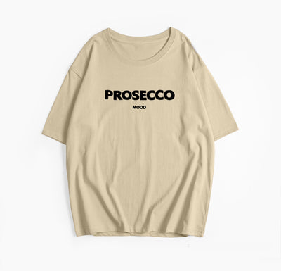 A khaki women's t-shirt with "PROSECCO MOOD" text printed on the front.