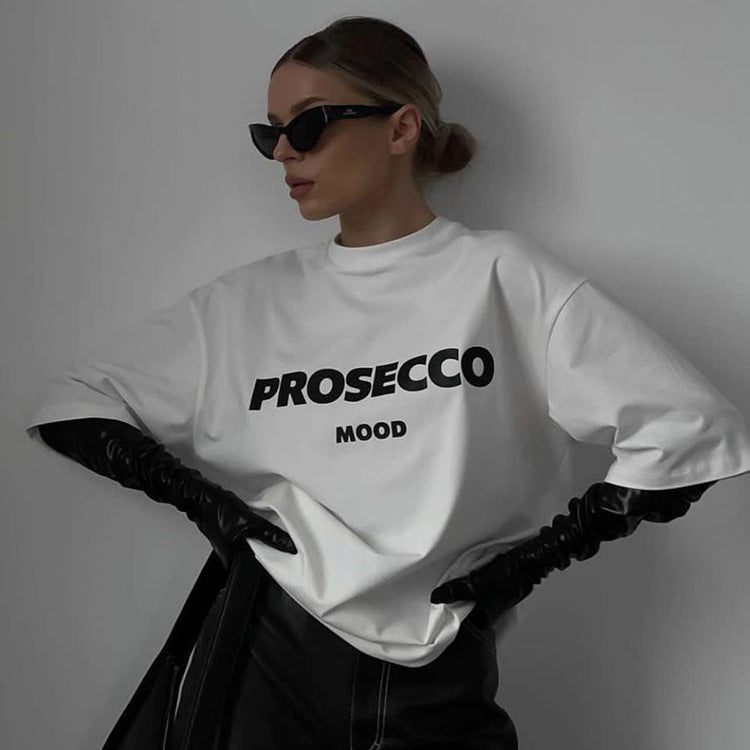 A model showcases wearing a white shirt with "PROSECCO MOOD" text printed on the front.